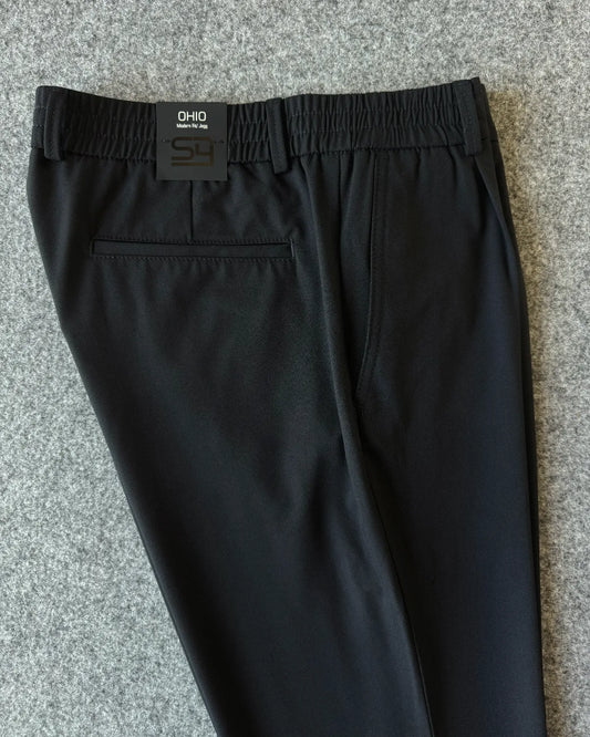 Dettaglio vita elastica e tasca posteriore pantalone blu - Archivio Tessile